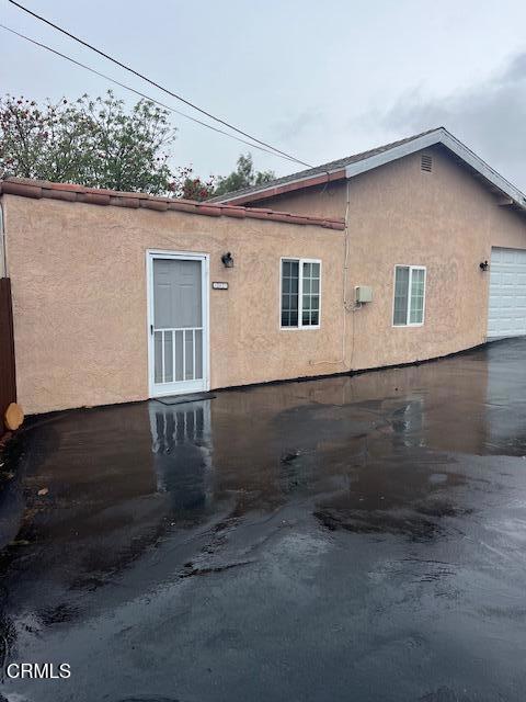 view of property exterior with a garage