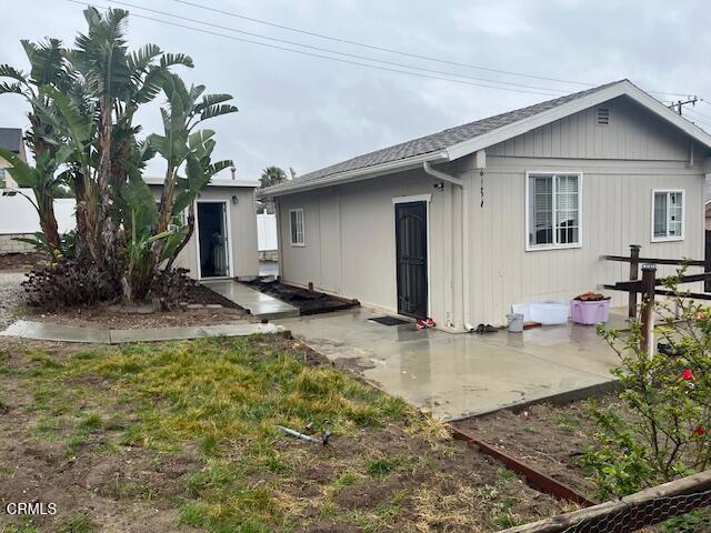 back of house with a patio