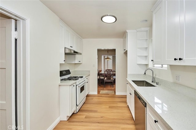 kitchen with dishwasher, sink, white range with gas stovetop, and white cabinets