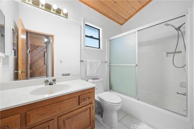 full bathroom with combined bath / shower with glass door, lofted ceiling, vanity, toilet, and tile patterned floors