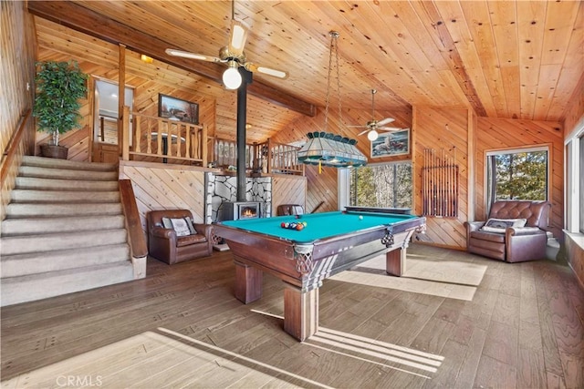 playroom with lofted ceiling, hardwood / wood-style floors, wooden ceiling, and wood walls