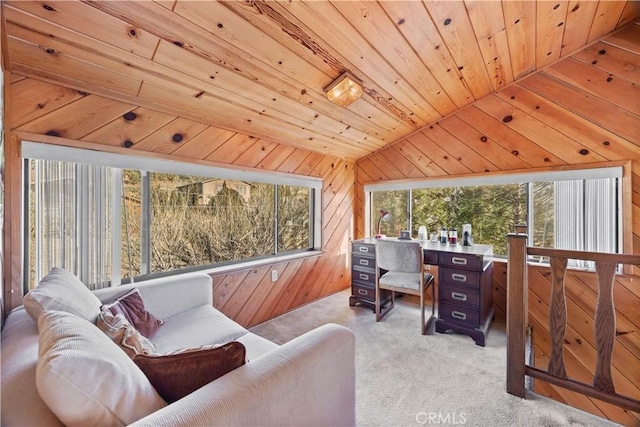 carpeted office space featuring vaulted ceiling, wood ceiling, and wood walls