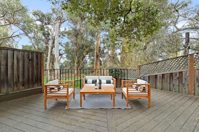 wooden terrace featuring outdoor lounge area