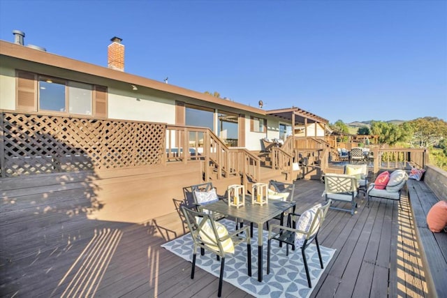 wooden deck featuring outdoor lounge area