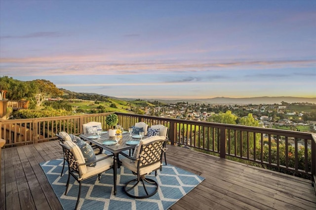 deck at dusk with a mountain view