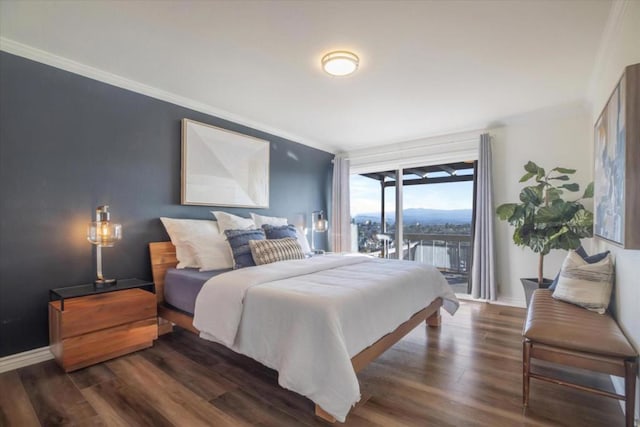 bedroom with dark wood-type flooring, access to outside, and ornamental molding