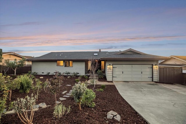 single story home featuring a garage