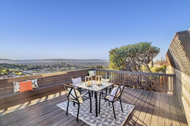 wooden deck featuring a water view