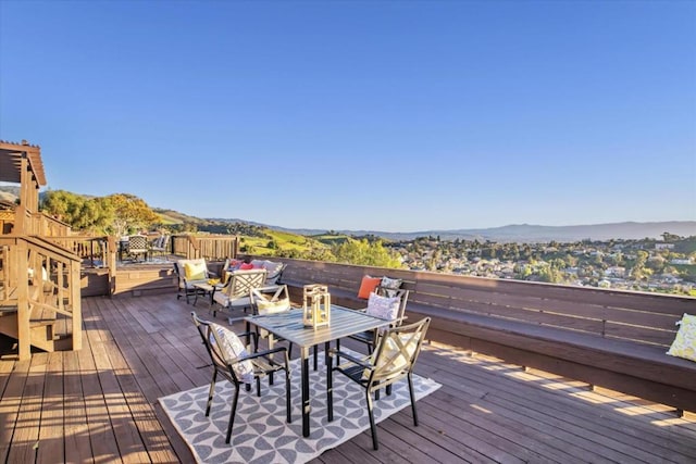 wooden deck featuring a mountain view