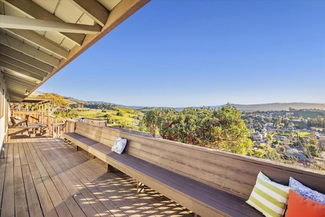 wooden deck featuring a mountain view