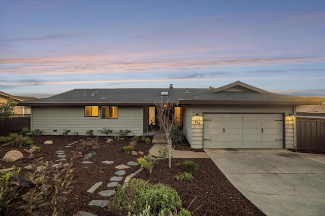 ranch-style house featuring a garage