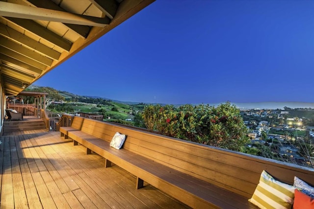 wooden terrace with outdoor lounge area