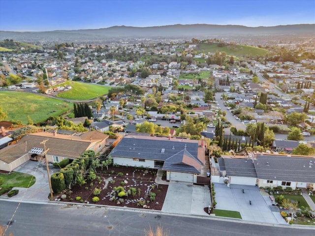 birds eye view of property with a mountain view