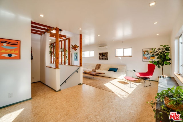 living room featuring a wall mounted AC