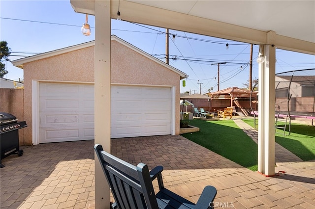 garage featuring a lawn