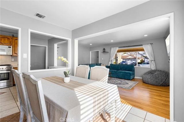 dining room with light hardwood / wood-style flooring