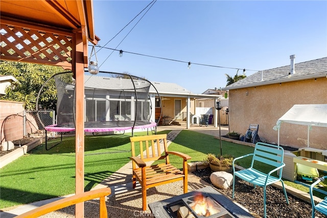 view of yard featuring a trampoline