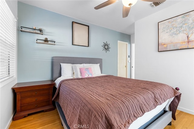 bedroom featuring ceiling fan and light wood-type flooring