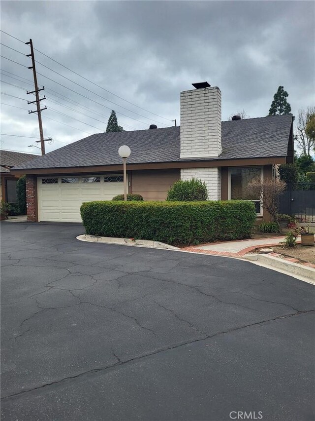 view of side of property with a garage