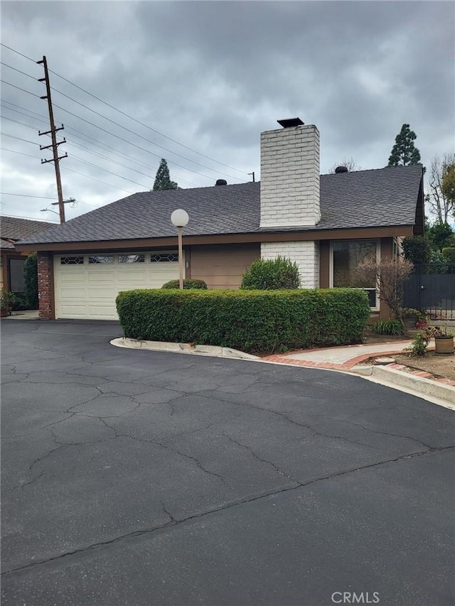 view of side of property featuring a garage