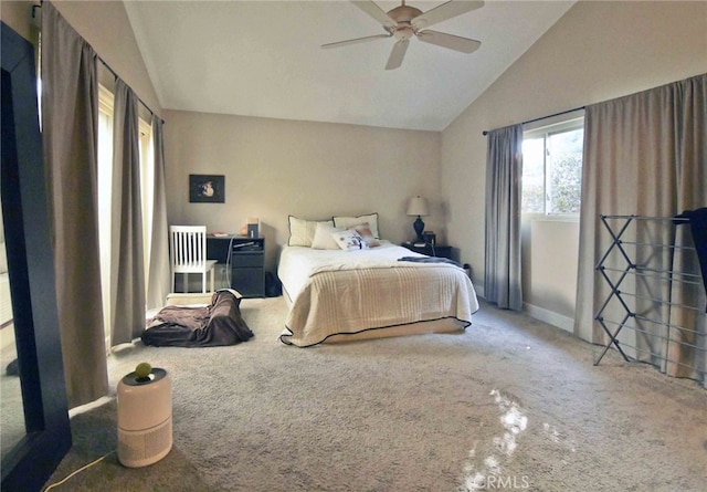 bedroom with carpet floors, vaulted ceiling, and ceiling fan