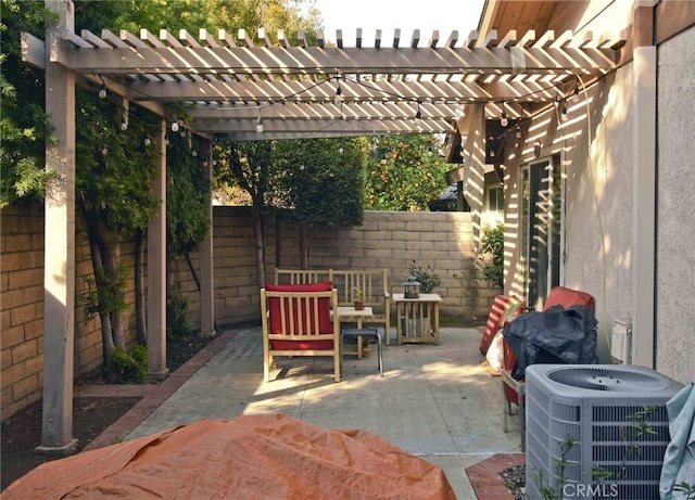 view of patio with cooling unit and a pergola