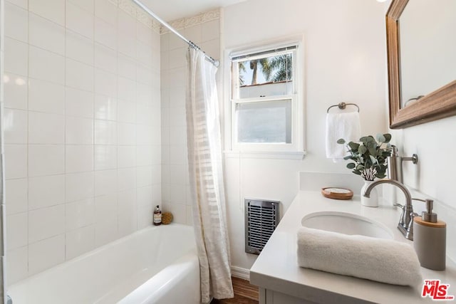 bathroom with vanity and shower / bath combo with shower curtain