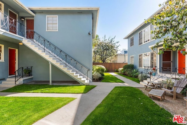 view of property's community with a yard