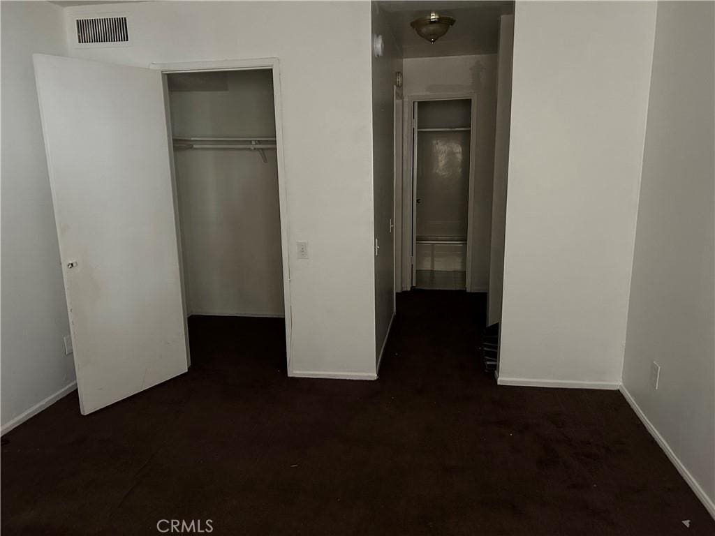 unfurnished bedroom featuring a closet