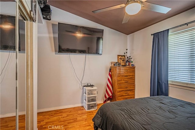 bedroom featuring ceiling fan, lofted ceiling, and light hardwood / wood-style floors