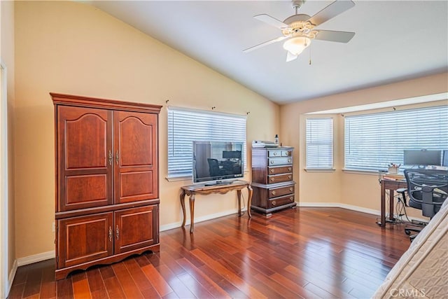 office area featuring ceiling fan, dark hardwood / wood-style flooring, and vaulted ceiling