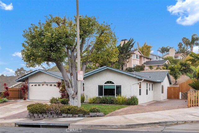 single story home featuring a garage