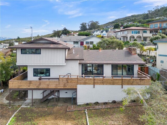 2741 Houston Dr, Los Osos, CA 93402 - rear view of house with stairs, a residential view, and a shingled roof