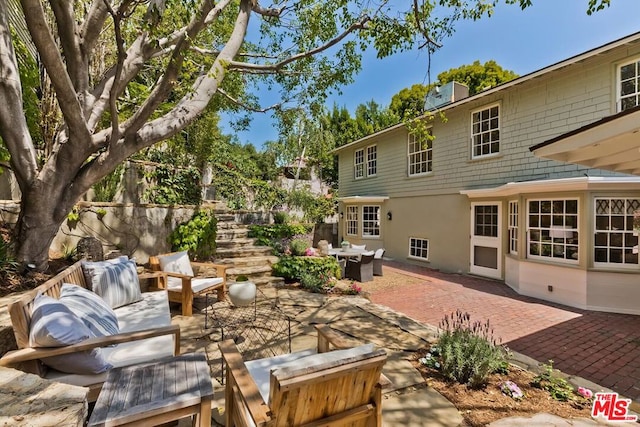 exterior space with an outdoor living space