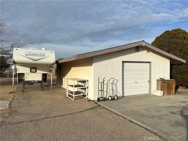 view of outbuilding with a garage