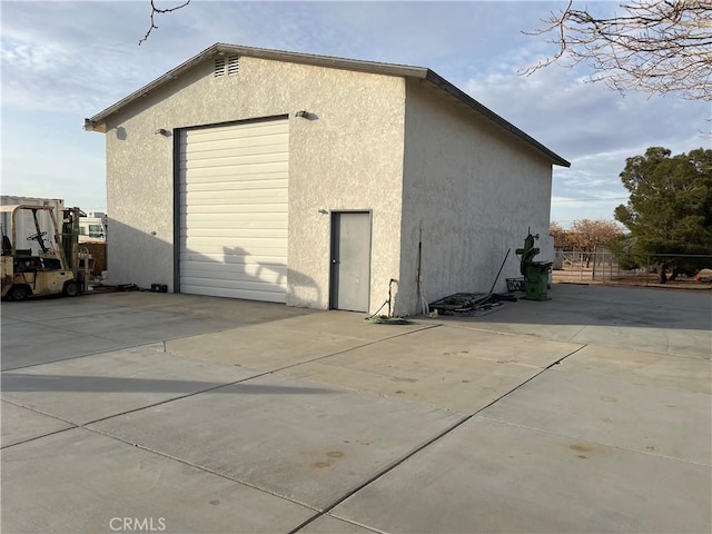 view of outbuilding featuring a garage