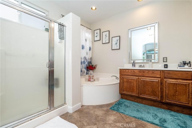 bathroom featuring vanity, tile patterned floors, and shower with separate bathtub