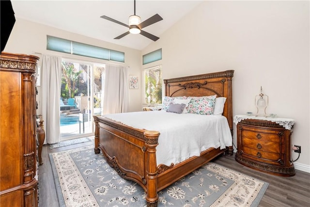 bedroom with lofted ceiling, dark hardwood / wood-style floors, access to outside, and ceiling fan