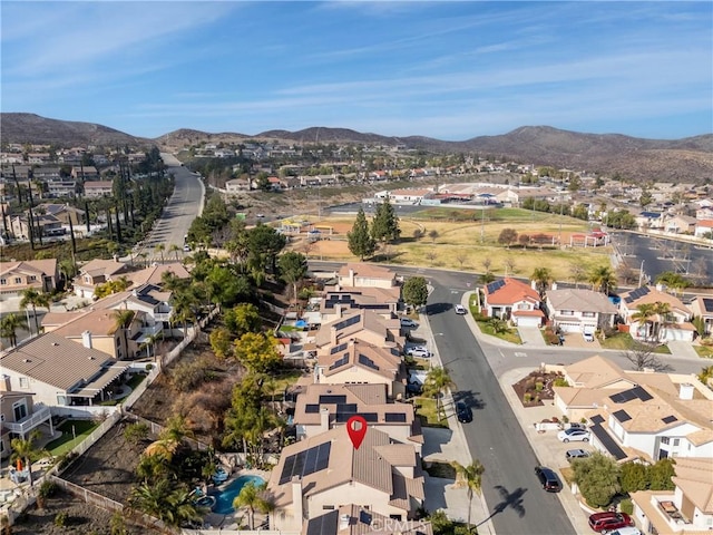 birds eye view of property featuring a mountain view