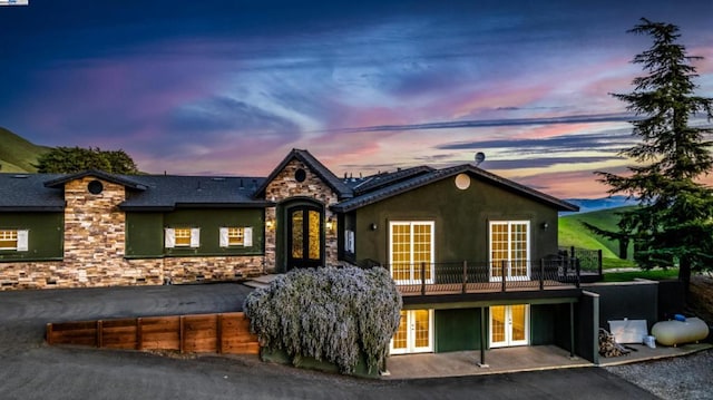 view of front of property featuring french doors and a patio area