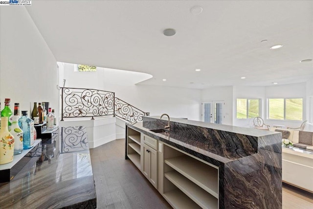 kitchen featuring sink, wood-type flooring, and french doors