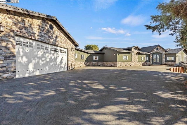 view of side of property with a garage