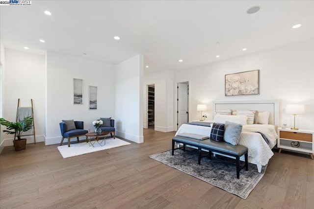 bedroom with light wood-type flooring