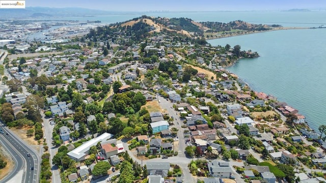 drone / aerial view with a water and mountain view