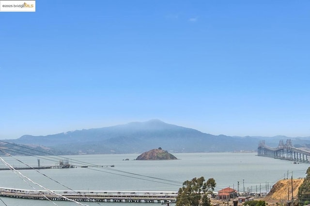 view of mountain feature featuring a water view