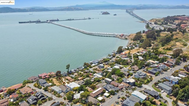 drone / aerial view with a water and mountain view