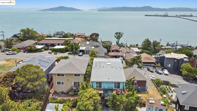 bird's eye view with a water and mountain view