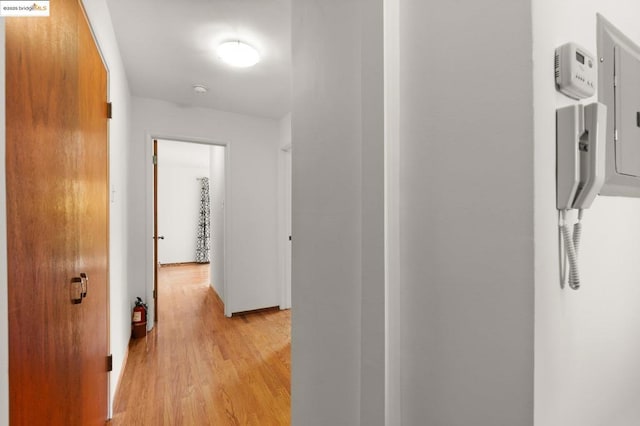 hall with light hardwood / wood-style floors