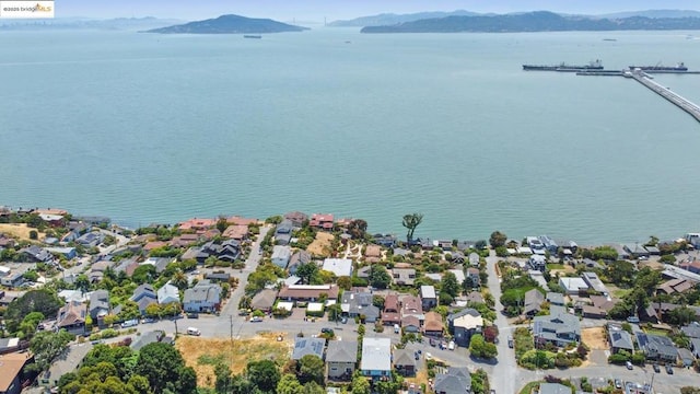 aerial view featuring a water and mountain view