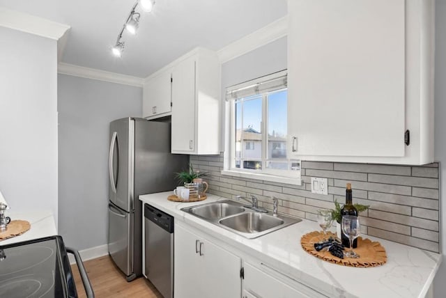 kitchen featuring sink, stainless steel dishwasher, and white cabinets